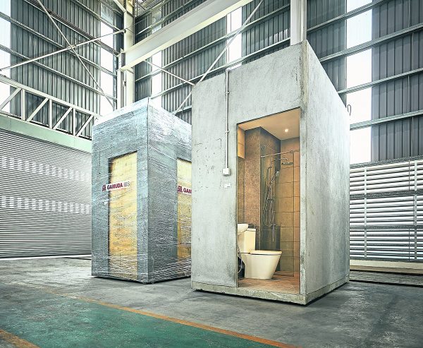 Fully-finished,prefabricated bathroom pods ready to be delivered and assembled on-site.