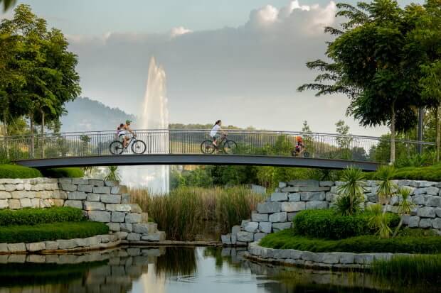 Visitors to the Waterfront Village can take a stroll or ride a bicycle along the lakeside.